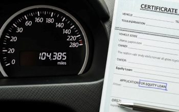 High mileage vehicle odometer showing over 100,000 miles with car title document for equity loan application